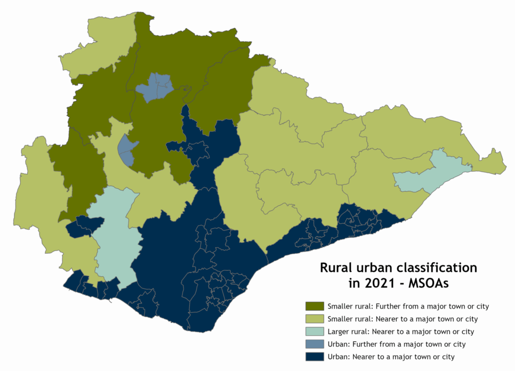 Map of East Sussex Middle layer super output areas (MSOAs), by rural/urban classification. The map shows that the whole of the coastal area out as far as Hastings, including Eastbourne, and other coastal towns are classified as Urban: Nearer to a major town or city. The urban area also includes the MSOA that covers Alfriston, Berwick and Hellingly to the west of Eastbourne, and the area around Heathfield. Outside of these areas, much of the middle of the county are classed as Smaller Rural: Nearer to a major town or city (coloured lighter green), with much of the northern part of the county in Wealden classed as Smaller Rural: Further from a major town or city (darker green). A larger area of MSOAs is classed as Urban than when looking at LSOAs or OAs.