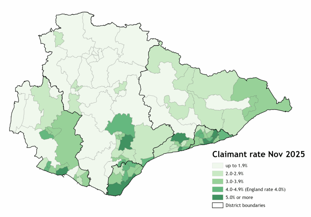 Map showing JSA/UC Claimant rate in East Sussex wards in November 2025. The map shows the areas with the highest rates as dark green, with all areas above the national average (4.0%) showing as dark or mid green. The areas with the highest claimant rates are mostly located in the southern coastal areas of the county, except for Hailsham East.